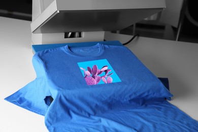 Image of Custom t-shirt. Using heat press to print image of violet cactus