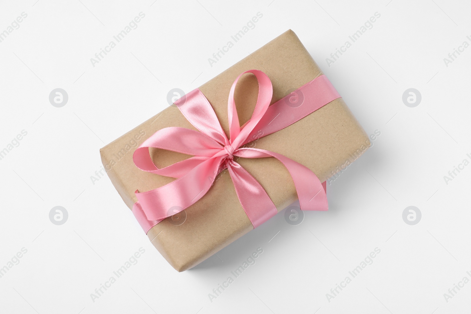 Photo of Beautiful gift box with pink bow on white background, top view