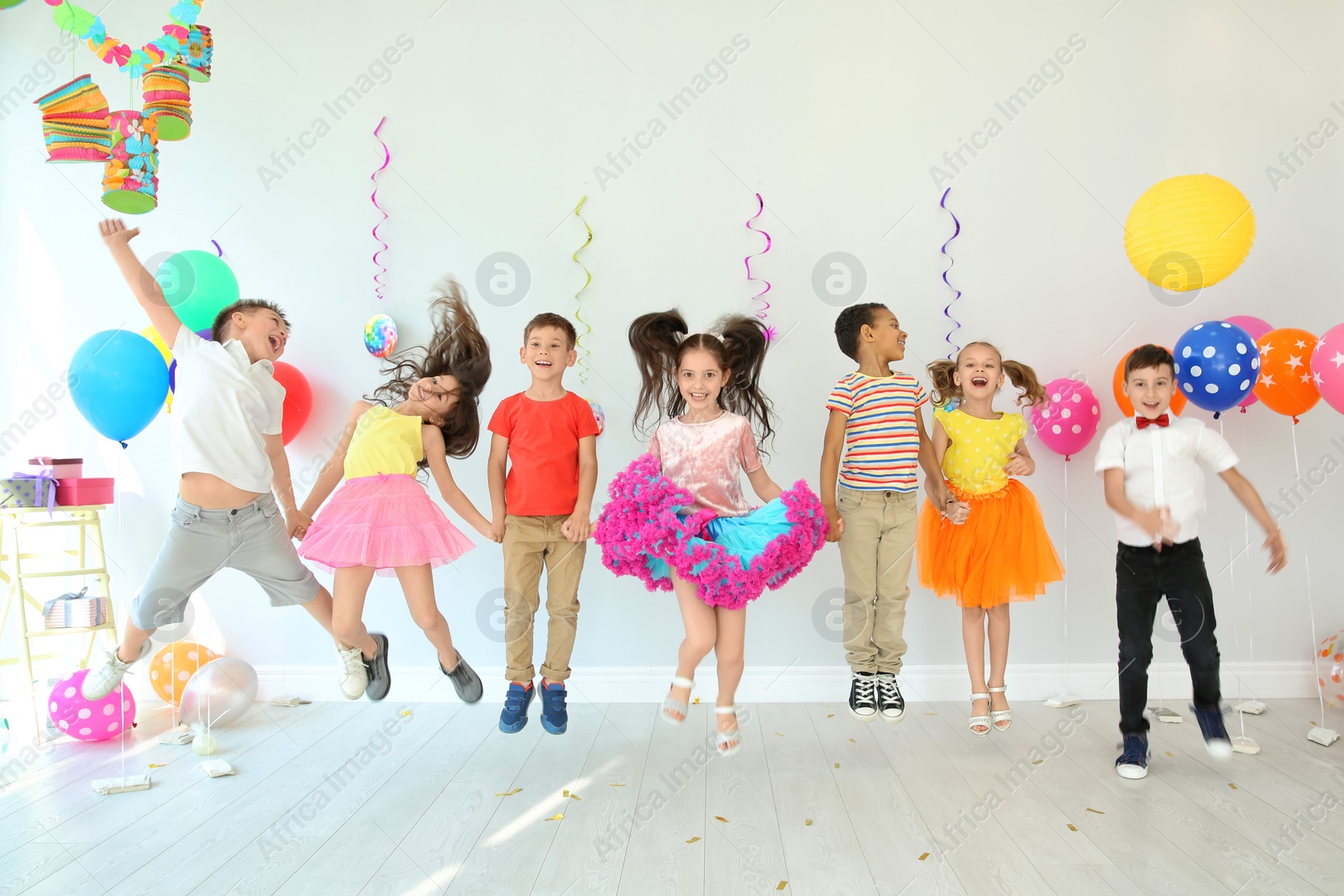 Photo of Cute little children at birthday party indoors