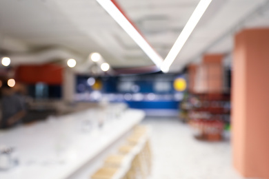Photo of Blurred view of big modern store. Wholesale market