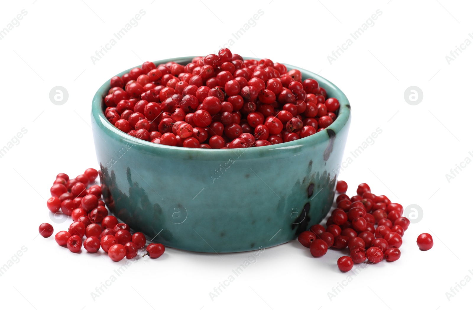 Photo of Aromatic spice. Red pepper in bowl isolated on white