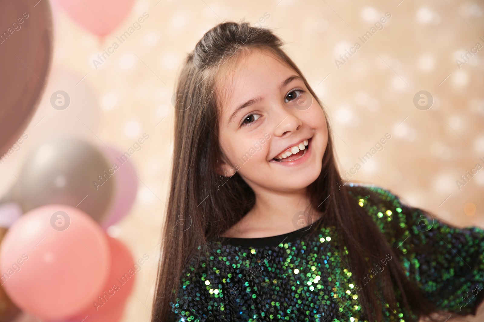 Photo of Portrait of laughing girl in beautifully decorated room