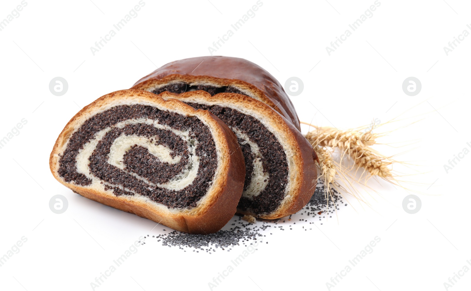 Photo of Slices of poppy seed roll and spikelets isolated on white. Tasty cake