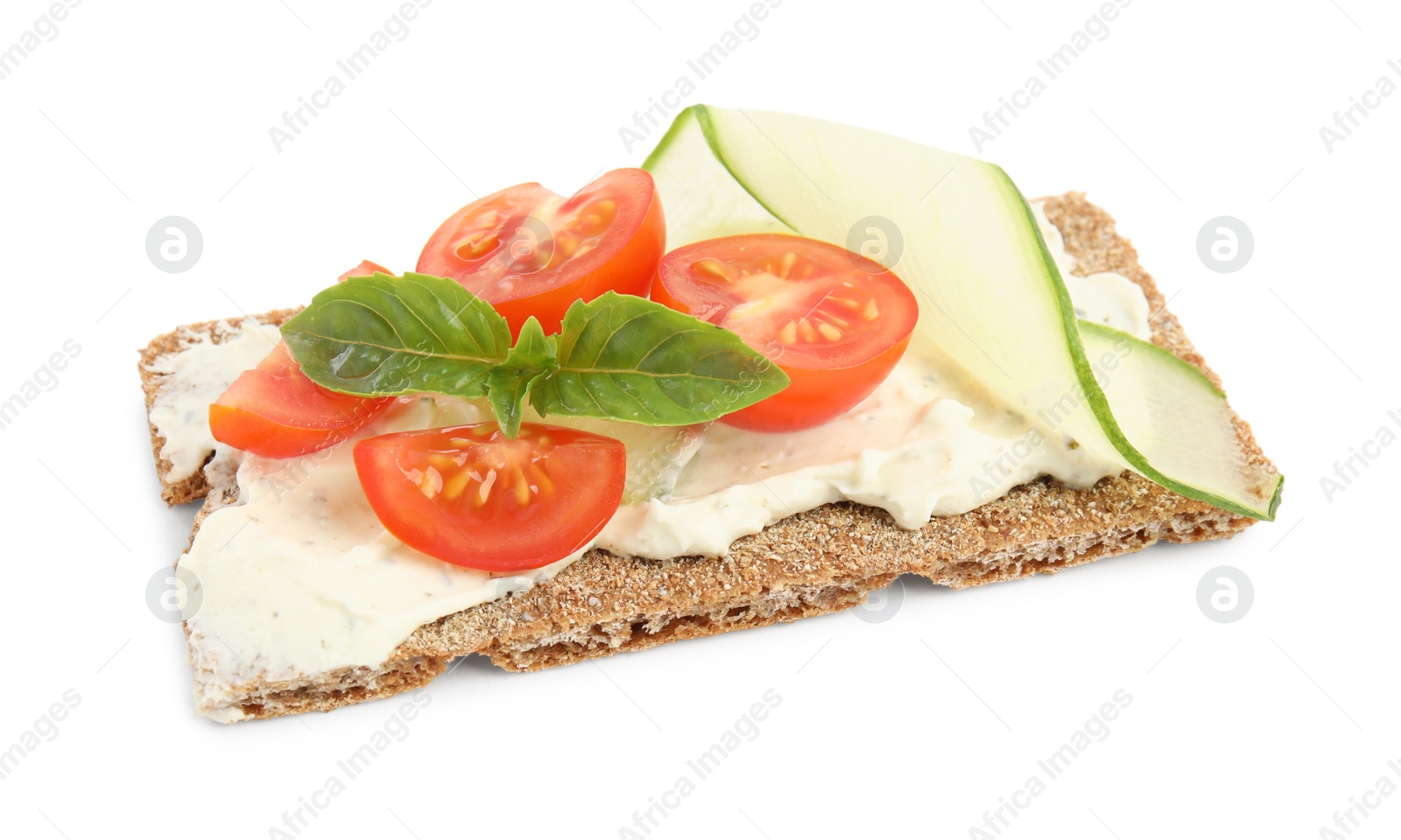 Photo of Fresh rye crispbread with cream cheese and vegetables isolated on white