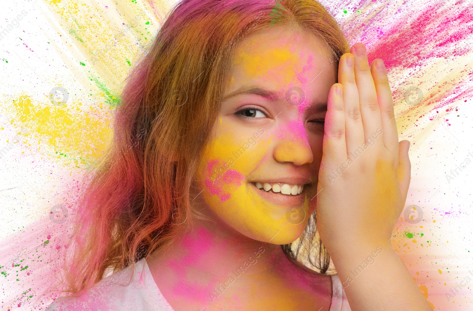 Image of Holi festival celebration. Happy teen girl covered with colorful powder dyes on white background