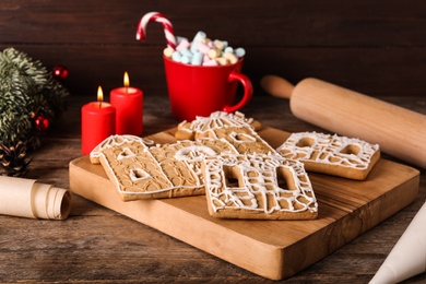 Photo of Parts of gingerbread house on wooden table