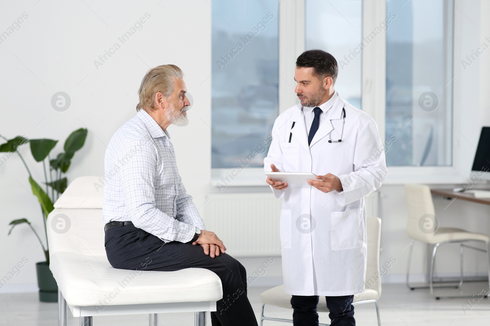 Photo of Senior patient having appointment with doctor in clinic