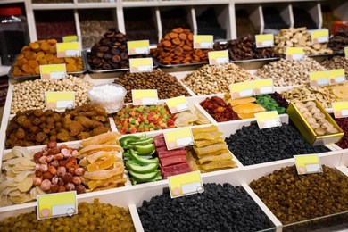 Assortment of delicious dried fruits and nuts at wholesale market