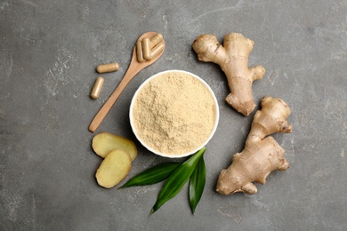 Photo of Flat lay composition with fresh and dry ginger on grey table