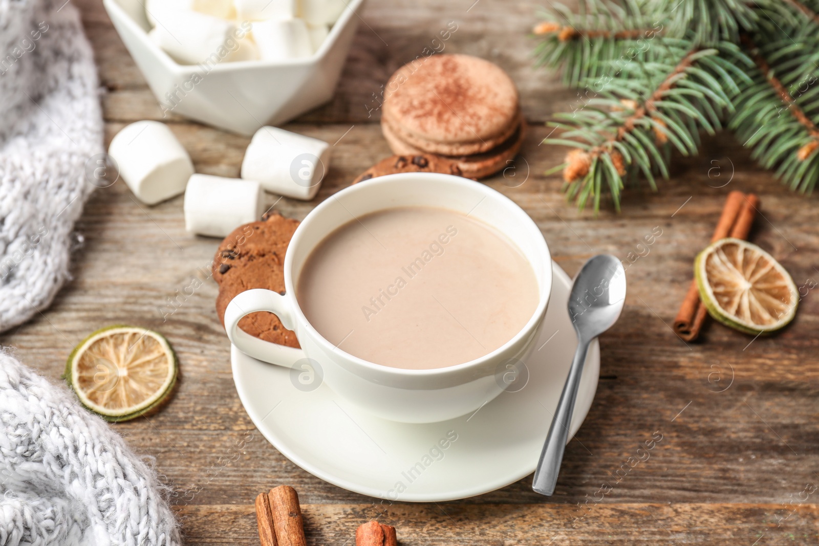 Photo of Composition with hot cocoa drink on wooden background