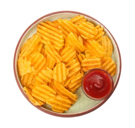 Photo of Plate of delicious ridged chips with ketchup isolated on white, top view