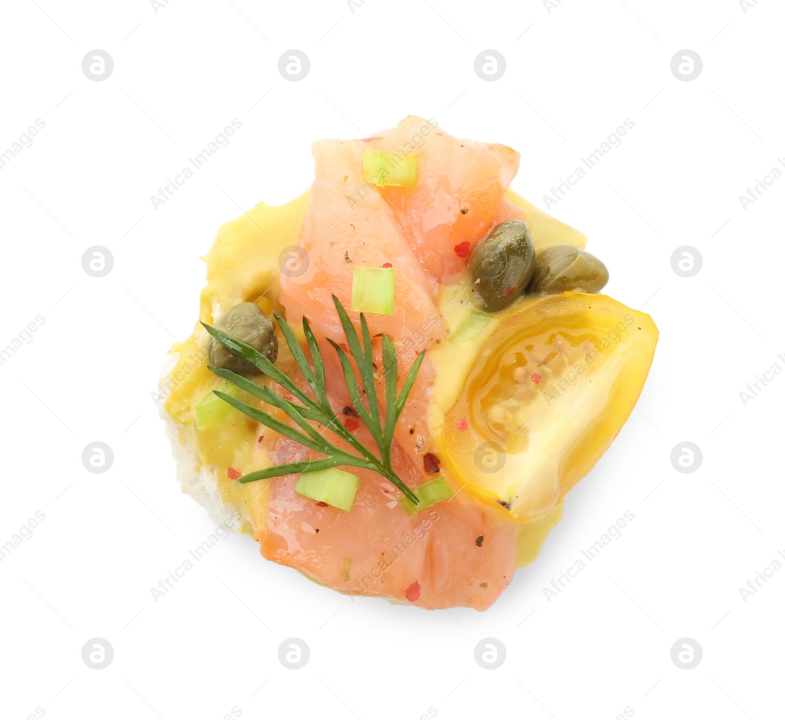 Photo of Tasty canape with salmon, tomatoes, capers and herbs isolated on white, top view