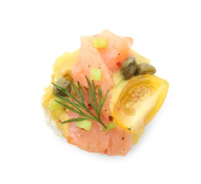Photo of Tasty canape with salmon, tomatoes, capers and herbs isolated on white, top view