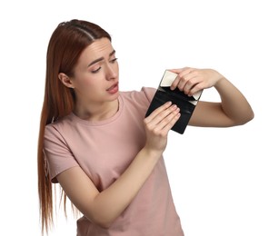 Upset woman with empty wallet on white background