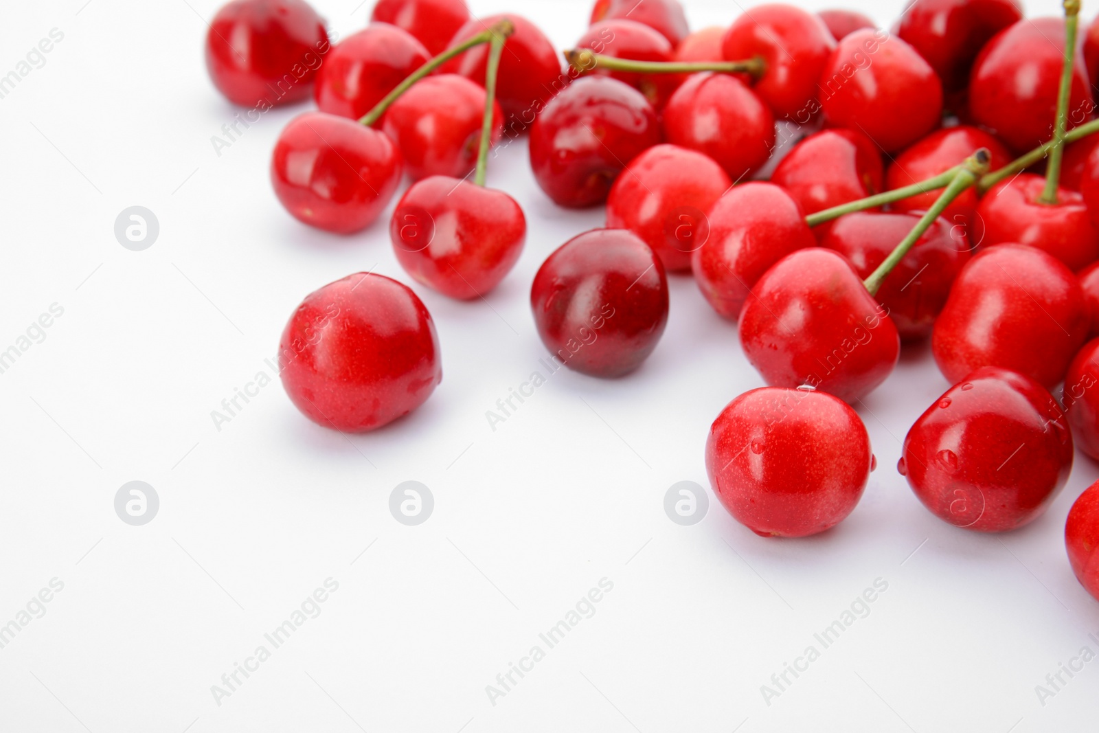 Photo of Sweet red cherries on white background