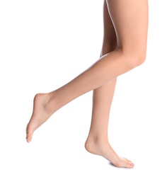 Photo of Woman with beautiful legs and feet on white background, closeup. Spa treatment