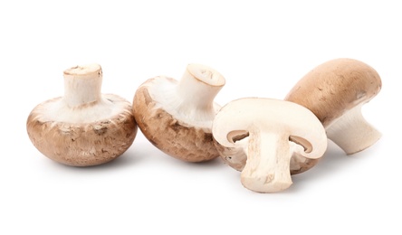 Photo of Fresh raw champignon mushrooms on white background