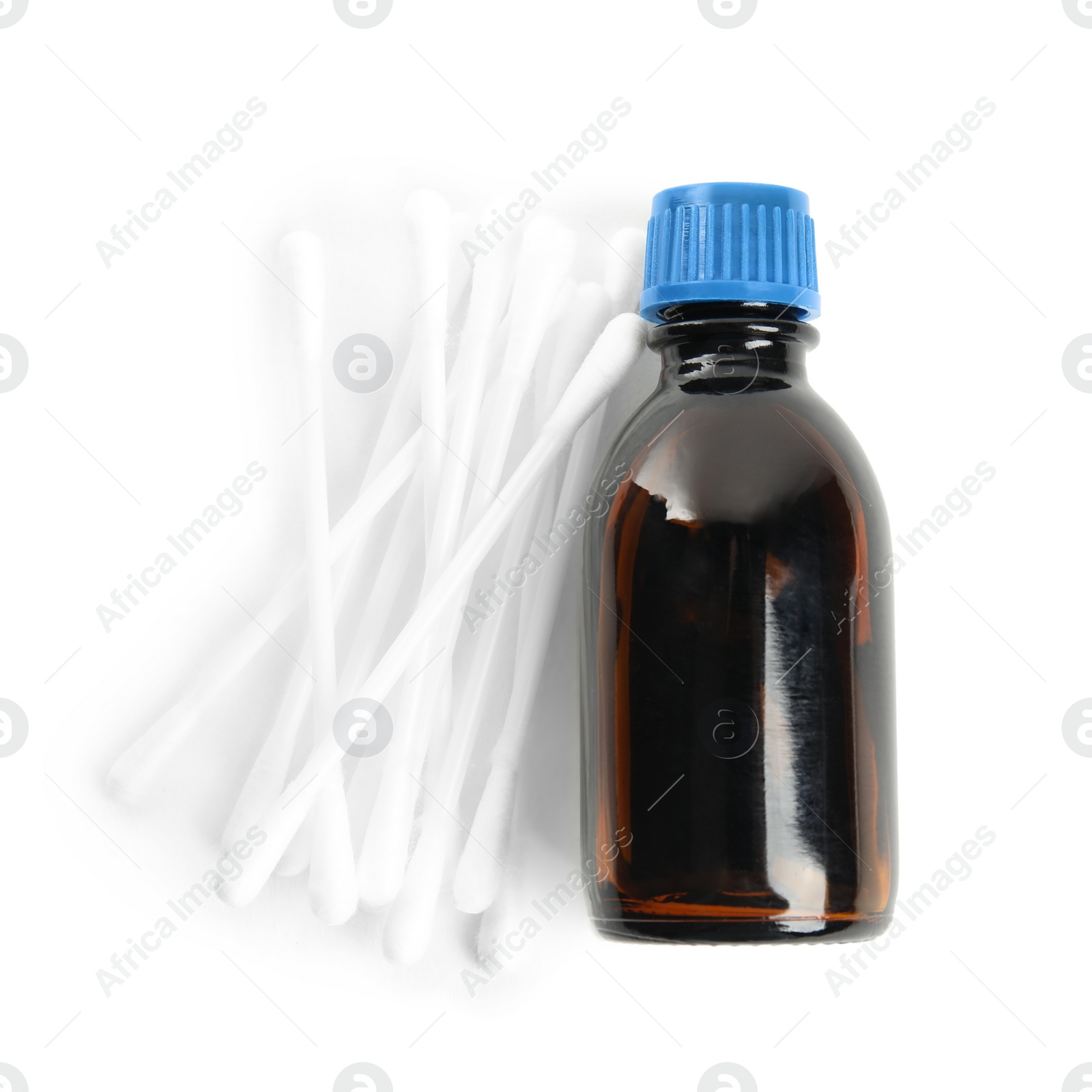 Photo of Bottle of medical iodine and cotton buds on white background, top view