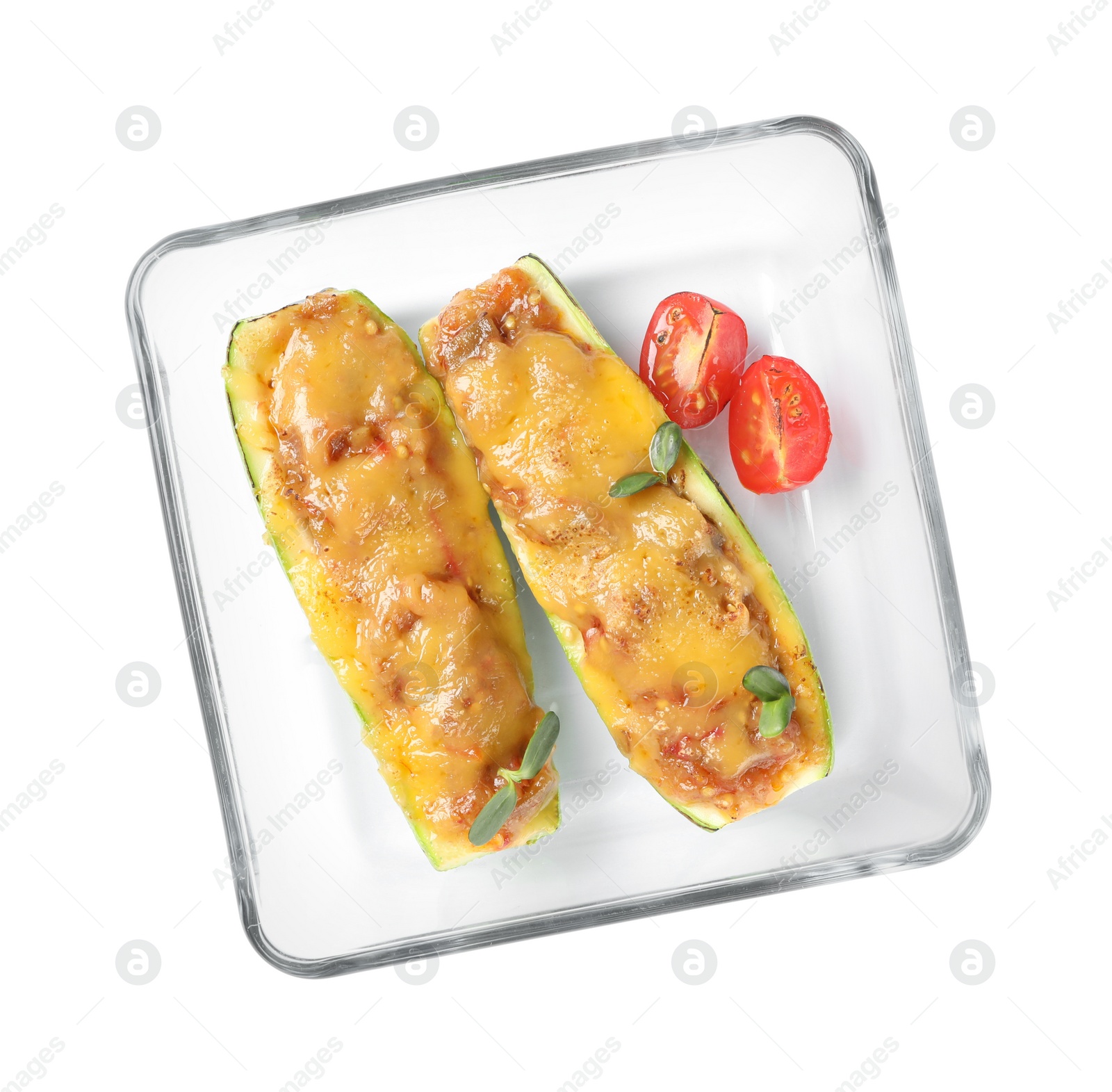 Photo of Baking dish with delicious stuffed zucchinis on white background, top view