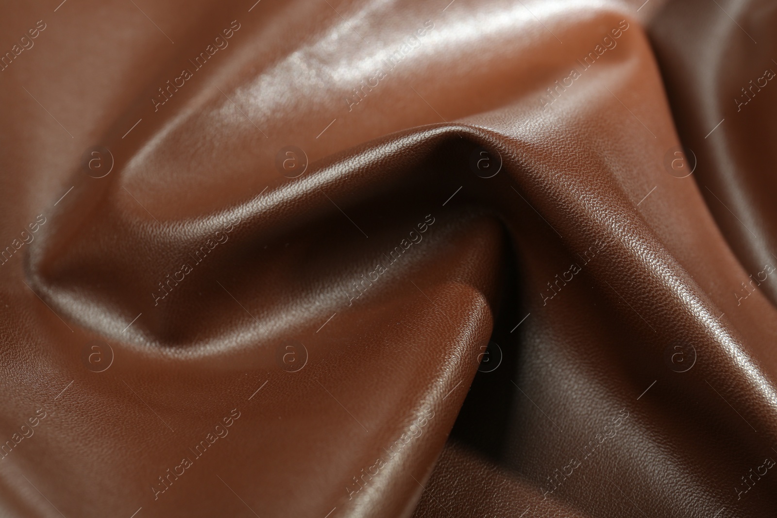 Photo of Brown natural leather as background, closeup view