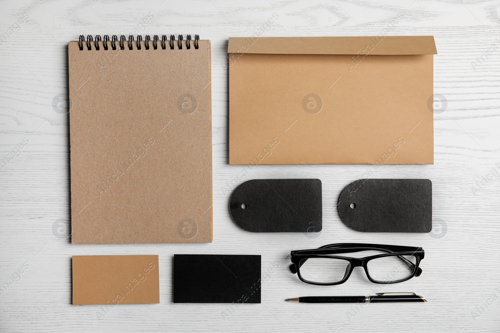 Photo of Flat lay composition with stationery on white wooden background. Mock up for design