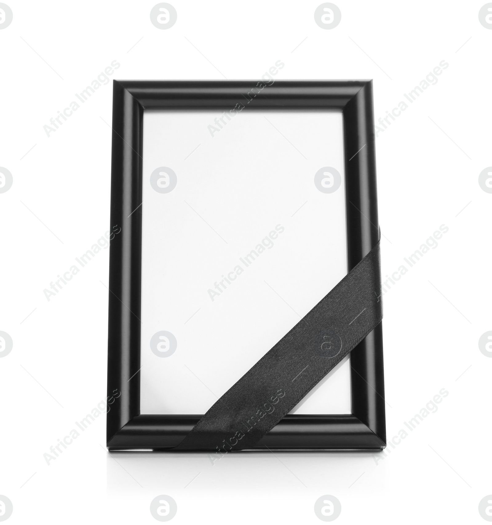 Photo of Funeral photo frame with black ribbon on white background. Space for design