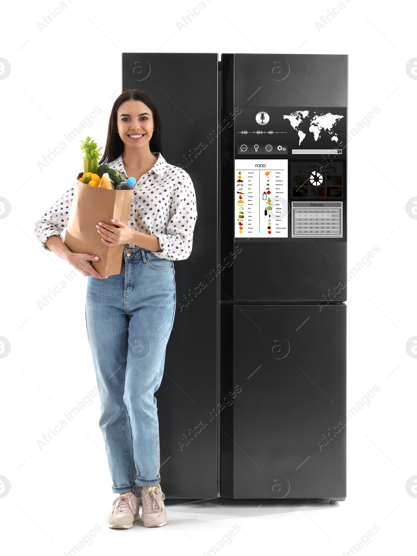 Image of Young woman with bag of groceries near smart refrigerator on white background
