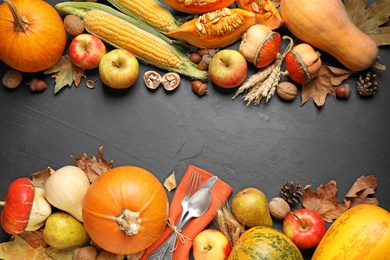 Flat lay composition with cutlery, autumn vegetables and fruits on grey background, space for text. Happy Thanksgiving day