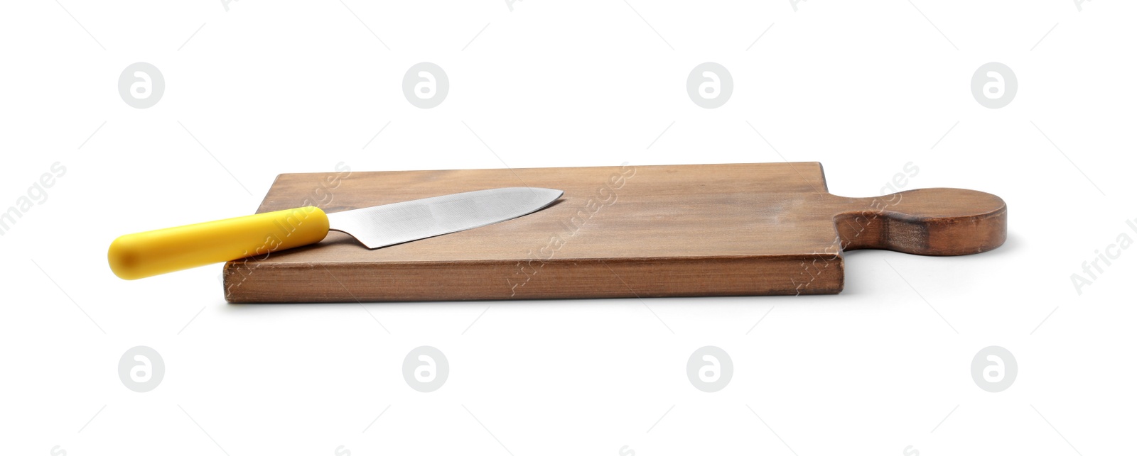 Photo of Stainless steel chef's knife with plastic handle on board against white background