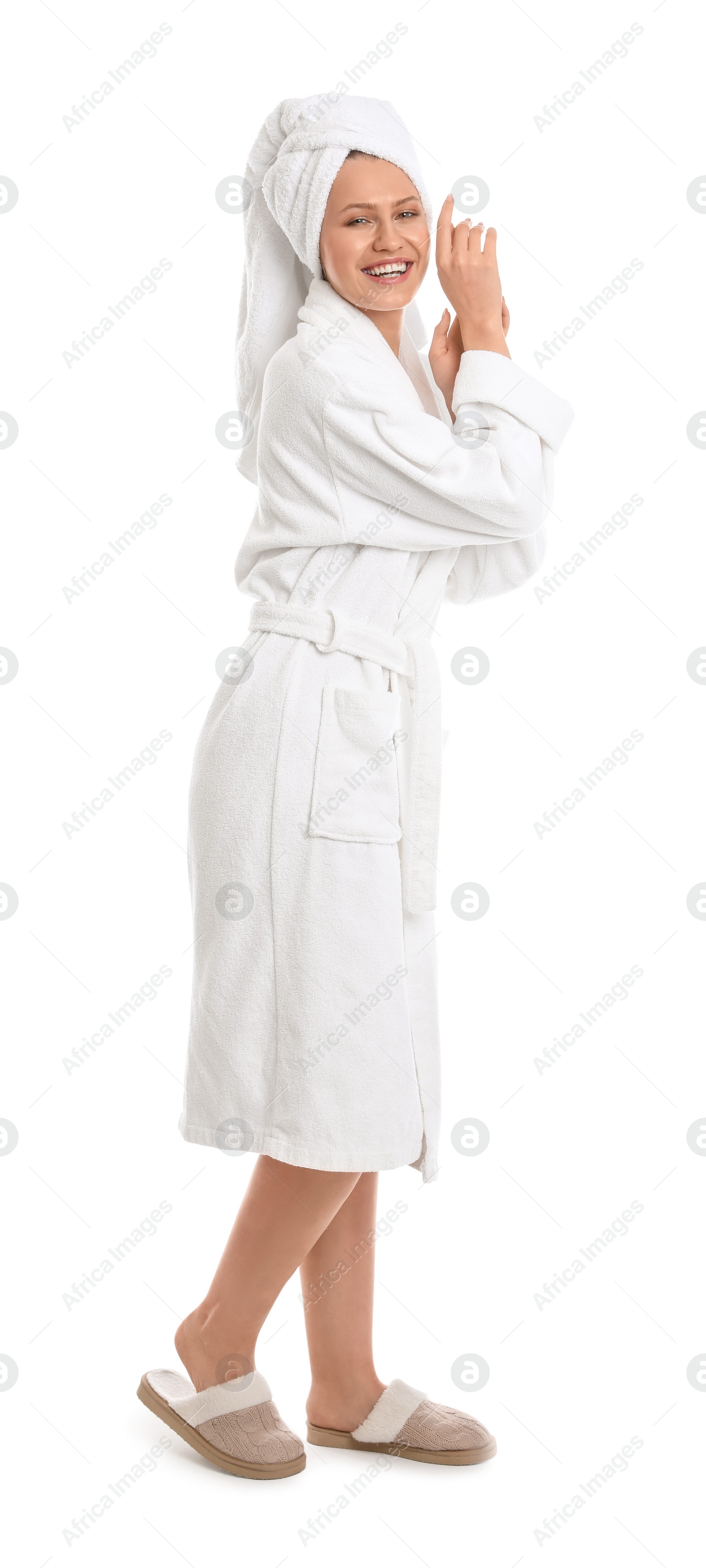 Photo of Young woman in bathrobe on white background