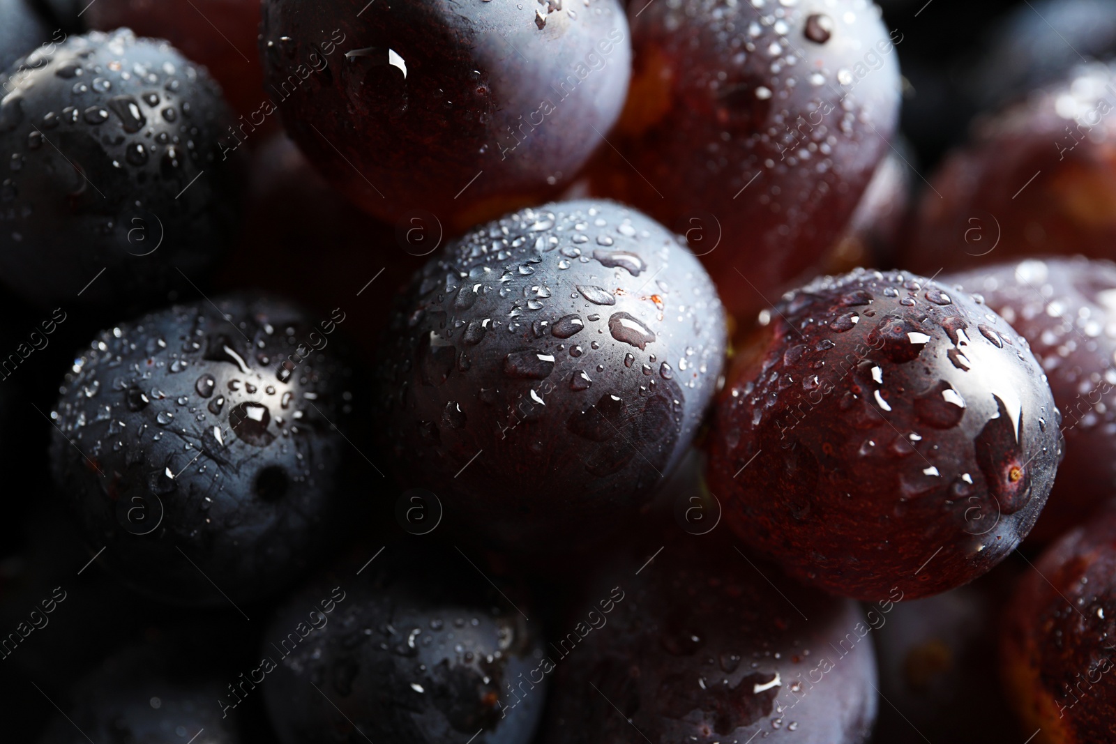 Photo of Bunch of fresh ripe juicy grapes as background, closeup