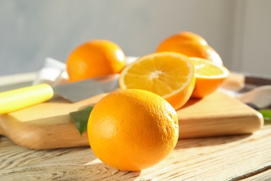 Fresh juicy oranges on wooden table. Healthy fruits