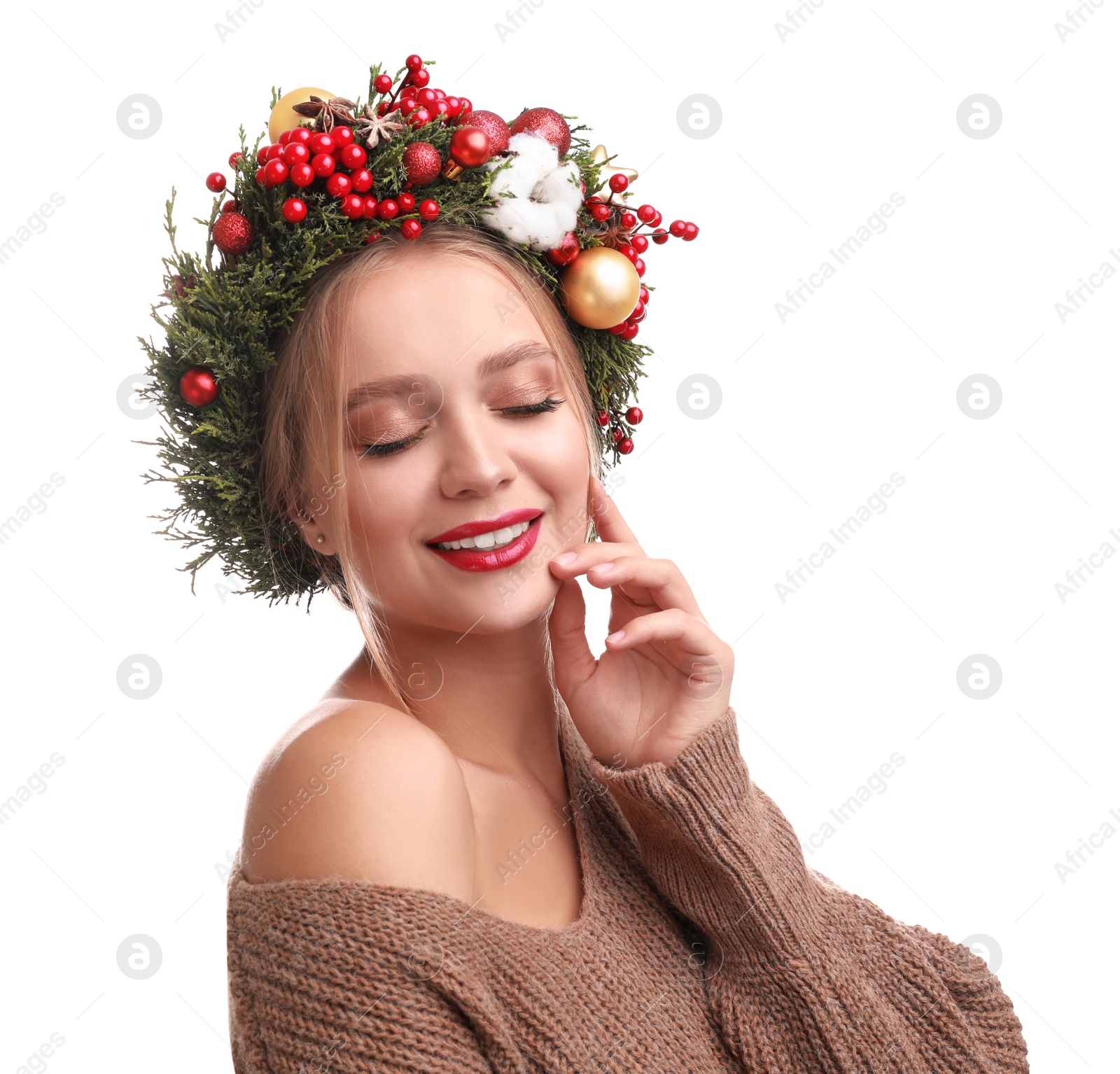 Photo of Beautiful young woman wearing Christmas wreath on white background