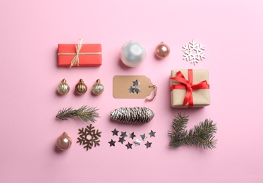 Photo of Flat lay composition with Christmas decor on light pink background