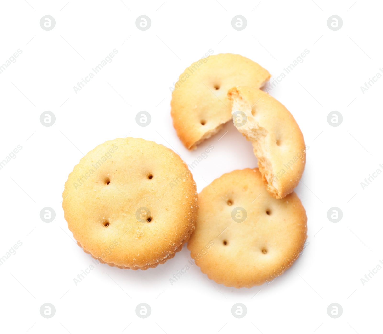 Photo of Delicious crispy crackers isolated on white, top view