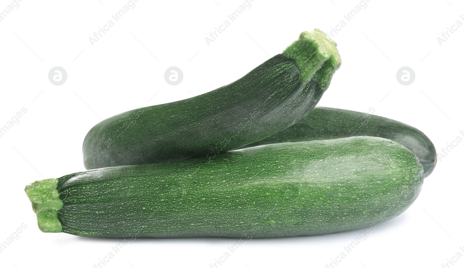 Photo of Fresh ripe green zucchinis isolated on white