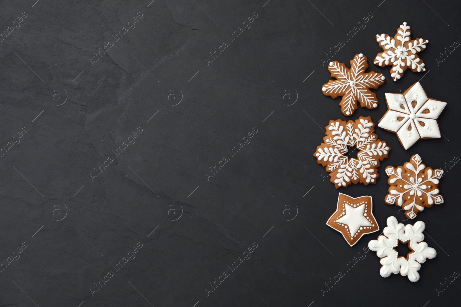 Photo of Different delicious Christmas cookies on black table, flat lay. Space for text