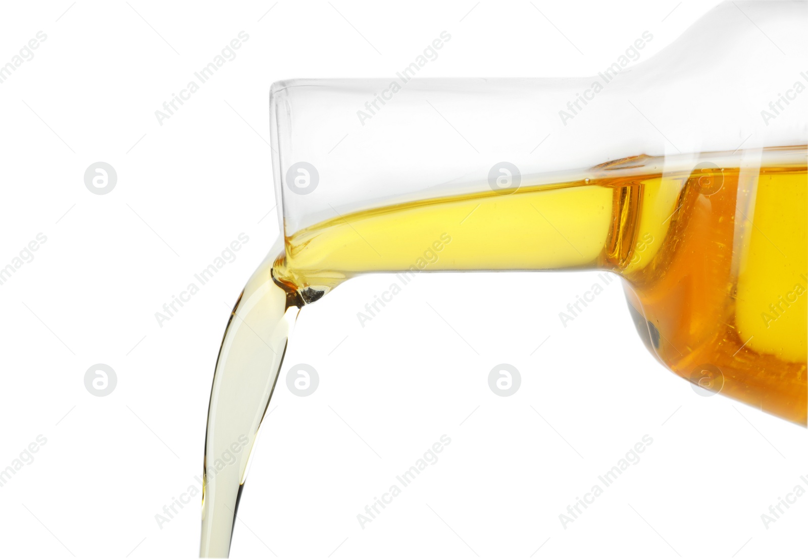 Photo of Pouring cooking oil from pitcher isolated on white