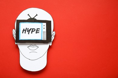 Image of Human blinded with hype in media field. Paper cutouts on red background, top view and space for text