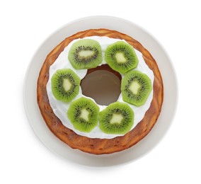 Photo of Homemade yogurt cake with kiwi and cream on white background, top view