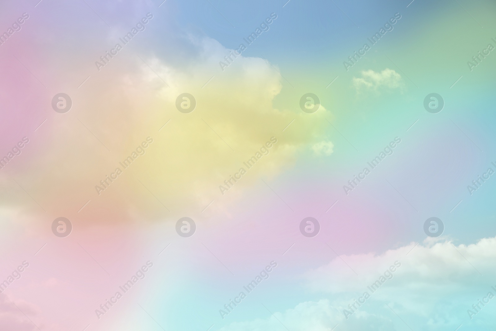 Image of Fantasy world. Picturesque view of beautiful magic sky with fluffy clouds, toned in pastel rainbow or unicorn colors