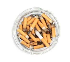 Photo of Glass ashtray full of cigarette stubs isolated on white, top view