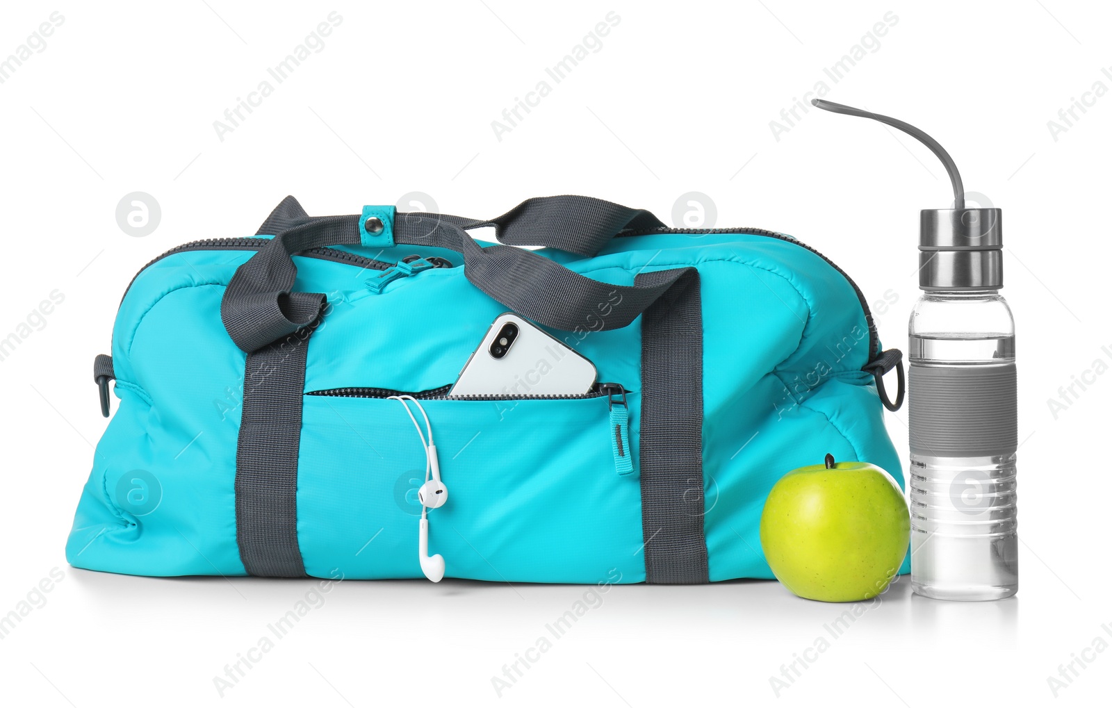 Photo of Sports bag and gym equipment on white background