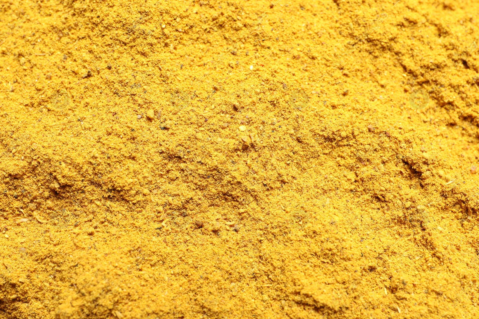 Photo of Dry curry powder as background, top view