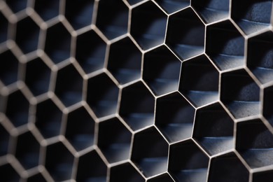 Photo of Texture of honeycomb grid for reflector as background, macro view
