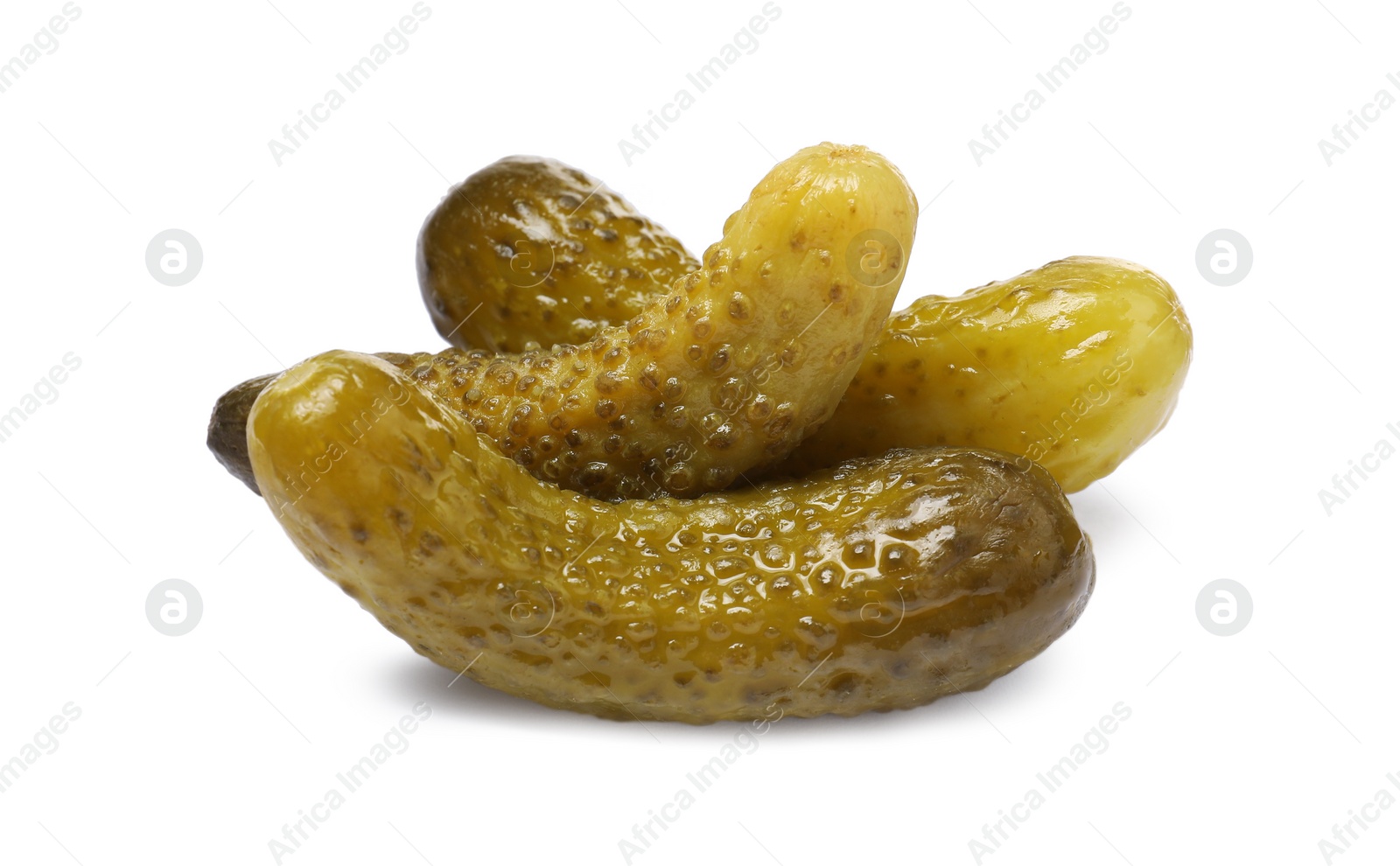 Photo of Pile of tasty pickled cucumbers isolated on white