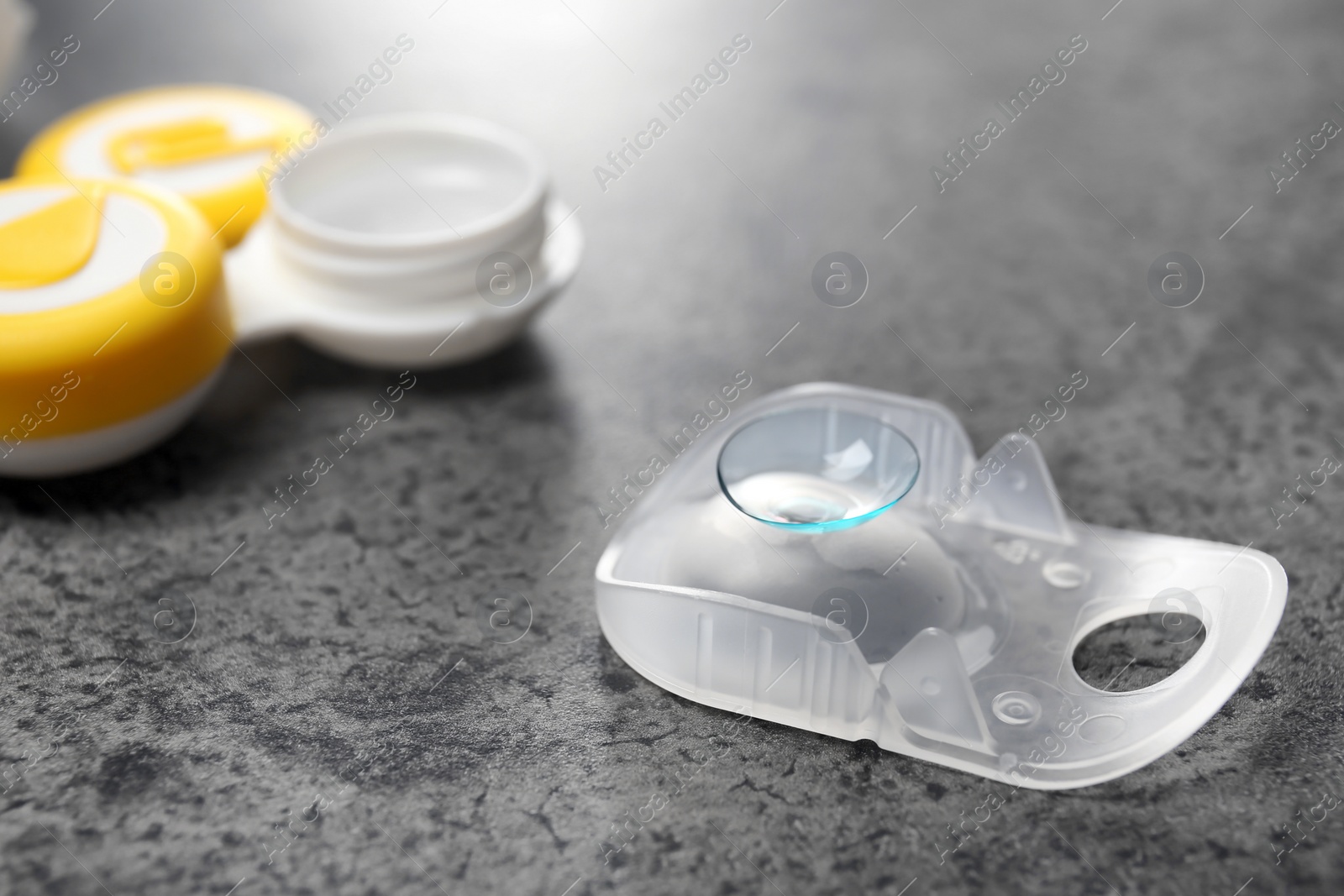 Photo of Contact lens on table, closeup