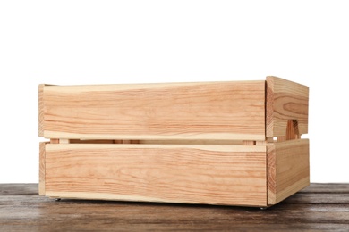 Photo of Empty rustic wooden crate on table against white background