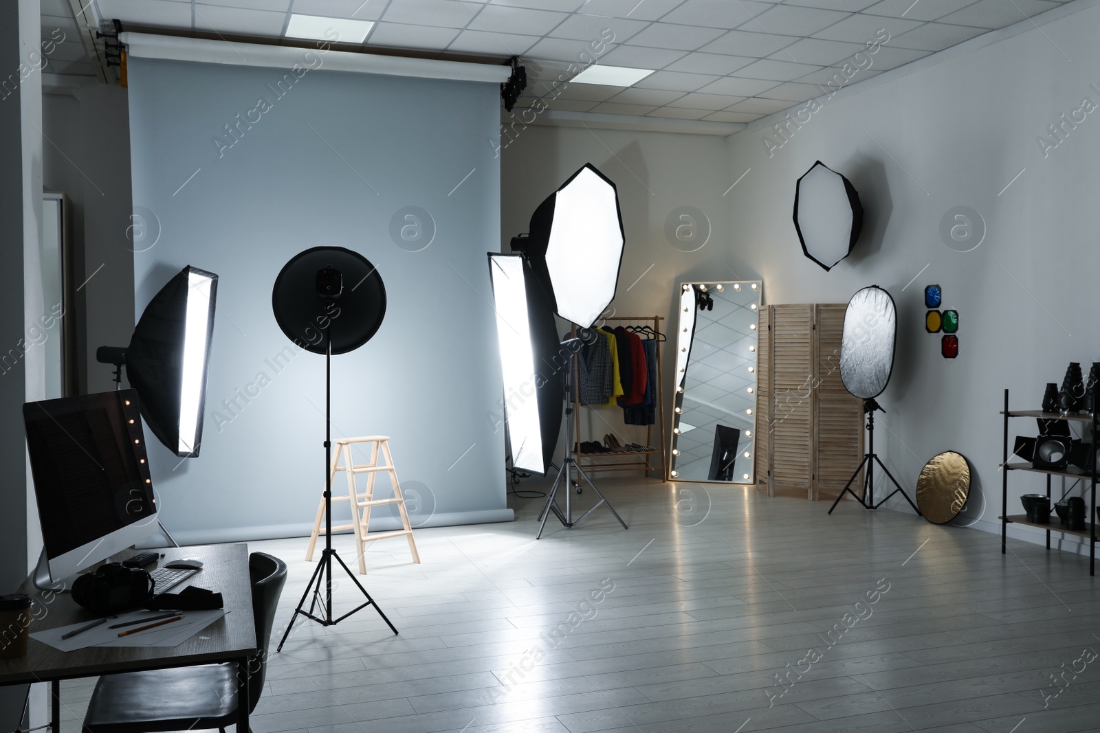 Photo of Interior of modern photo studio with professional equipment