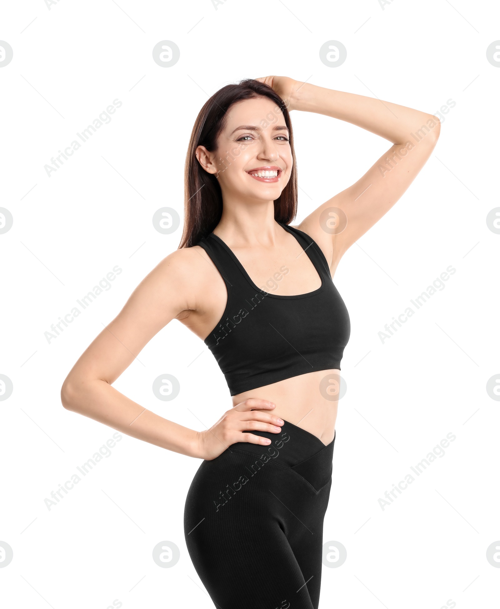 Photo of Happy young woman with slim body posing on white background